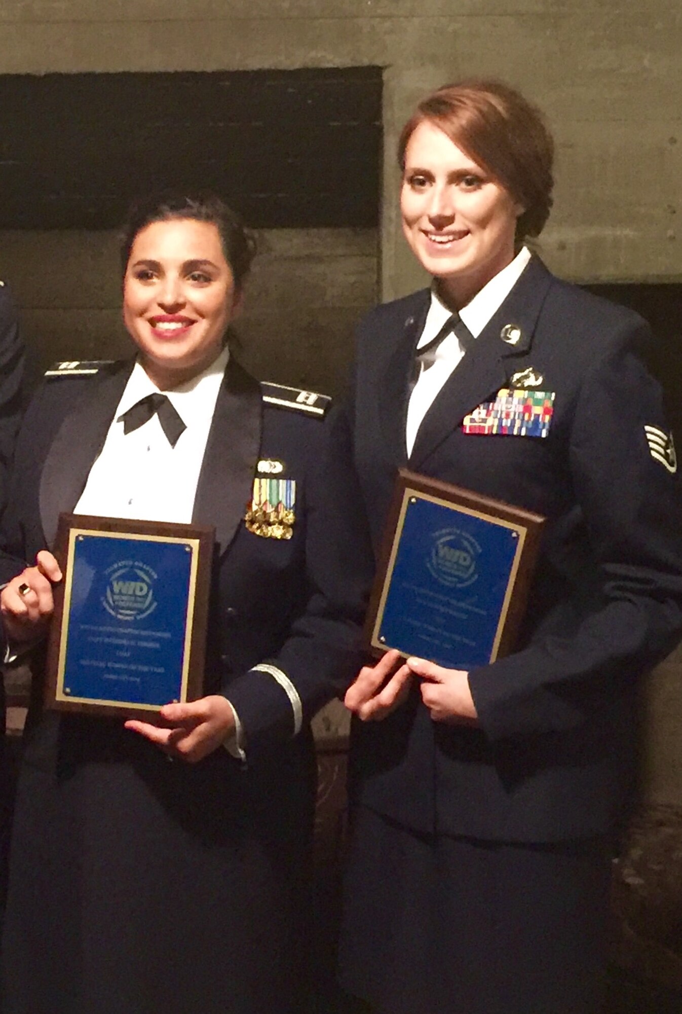 Capt Natassia Cherne, 1st Combat Camera Squadron assistant director of
operations, left, and Staff Sgt. Sandra Welch, 1st CTCS aerial combat
photojournalist, stand together after winning the Military Woman of the Year
award in their respective grade category Founders Hall at Charles Towne
Landing, Feb. 25, 2016.  The Women in Defense, Palmetto Chapter hosts the
MWOY event annually to honor the women in the armed forces and to show
gratitude for their service to the country.