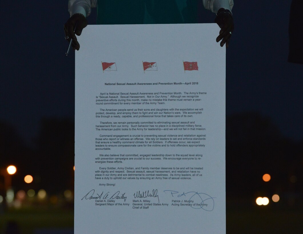 Kevin J. Parker, Joint Base Langley-Eustis Sexual Assault Prevention and Response Program coordinator, displays the Sexual Assault Awareness Month proclamation at Fort Eustis, Va., April 1, 2016. The proclamation outlines the Army’s theme in battling sexual assault this year, which is “Sexual Assault. Sexual Harassment. Not in Our Army.”  (U.S. Air Force photo by Staff Sgt. Natasha Stannard)