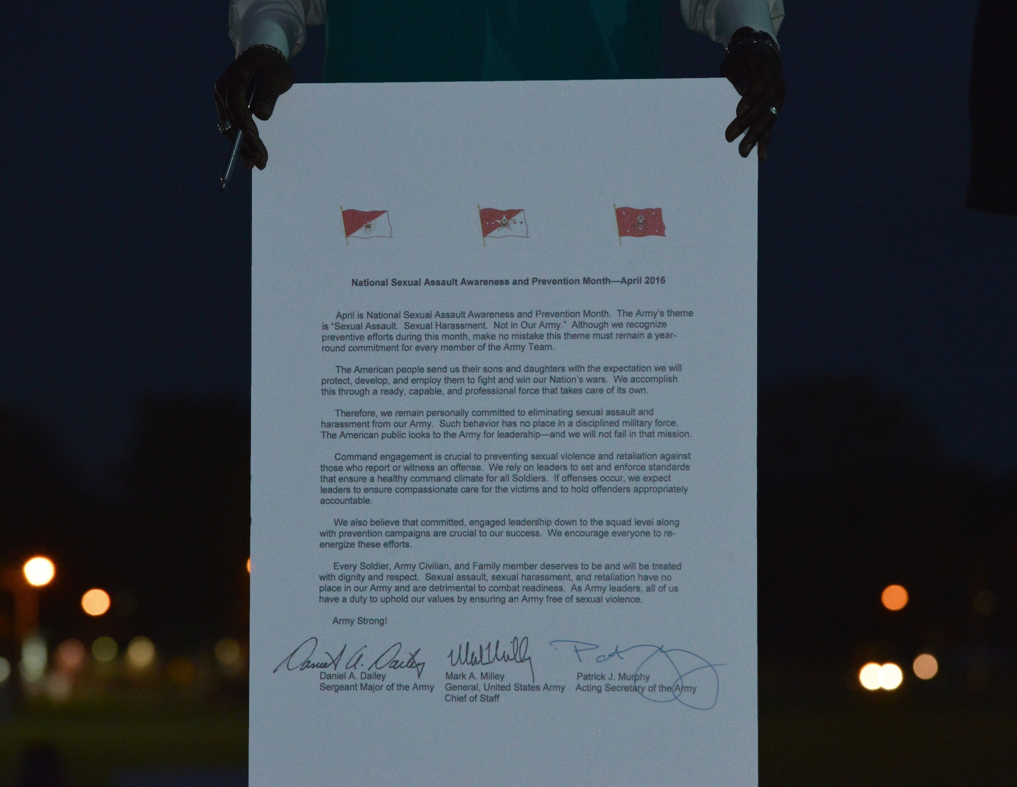 Kevin J. Parker, Joint Base Langley-Eustis Sexual Assault Prevention and Response Program coordinator, displays the Sexual Assault Awareness Month proclamation at Fort Eustis, Va., April 1, 2016. The proclamation outlines the Army’s theme in battling sexual assault this year, which is “Sexual Assault. Sexual Harassment. Not in Our Army.”  (U.S. Air Force photo by Staff Sgt. Natasha Stannard)