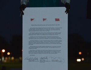 Kevin J. Parker, Joint Base Langley-Eustis Sexual Assault Prevention and Response Program coordinator, displays the Sexual Assault Awareness Month proclamation at Fort Eustis, Va., April 1, 2016. The proclamation outlines the Army’s theme in battling sexual assault this year, which is “Sexual Assault. Sexual Harassment. Not in Our Army.”  (U.S. Air Force photo by Staff Sgt. Natasha Stannard)