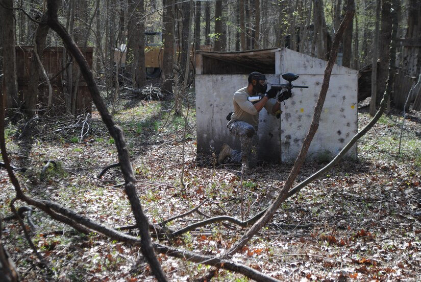 U.S. Soldiers assigned to the Headquarters and Headquarters Detachment, 53rd Transportation Battalion Movement Control, await to ambush the opposing team as they prepare to defend their objective at Virginia Beach, Va., March 24th, 2016. The Soldiers of HHD went through three scenarios which tested battle drills react to contact, react to ambush and squad-based tactical movements. (U.S. Army Photo by Sergeant First Class Michelle Michelson)