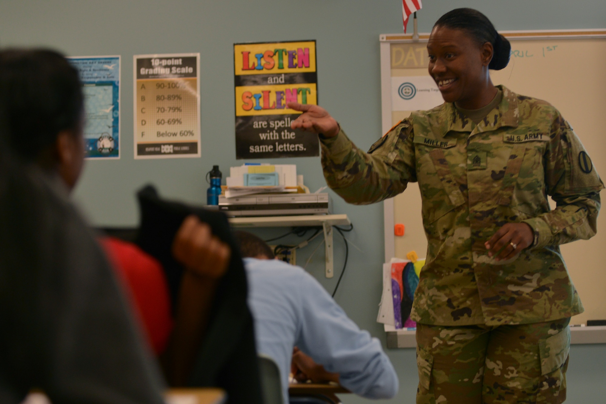 U.S. Army Sgt. Maj. Caprecia Miller, the Sexual Harassment and Assault Response and Prevention program manager for U.S. Army Training and Doctrine Command, speaks with students at Booker T. Washington Middle School in Newport News, Va., April 1, 2016. Miller was visiting with the students as part of a career day. (U.S. Air Force photo by Staff Sgt. Natasha Stannard)
