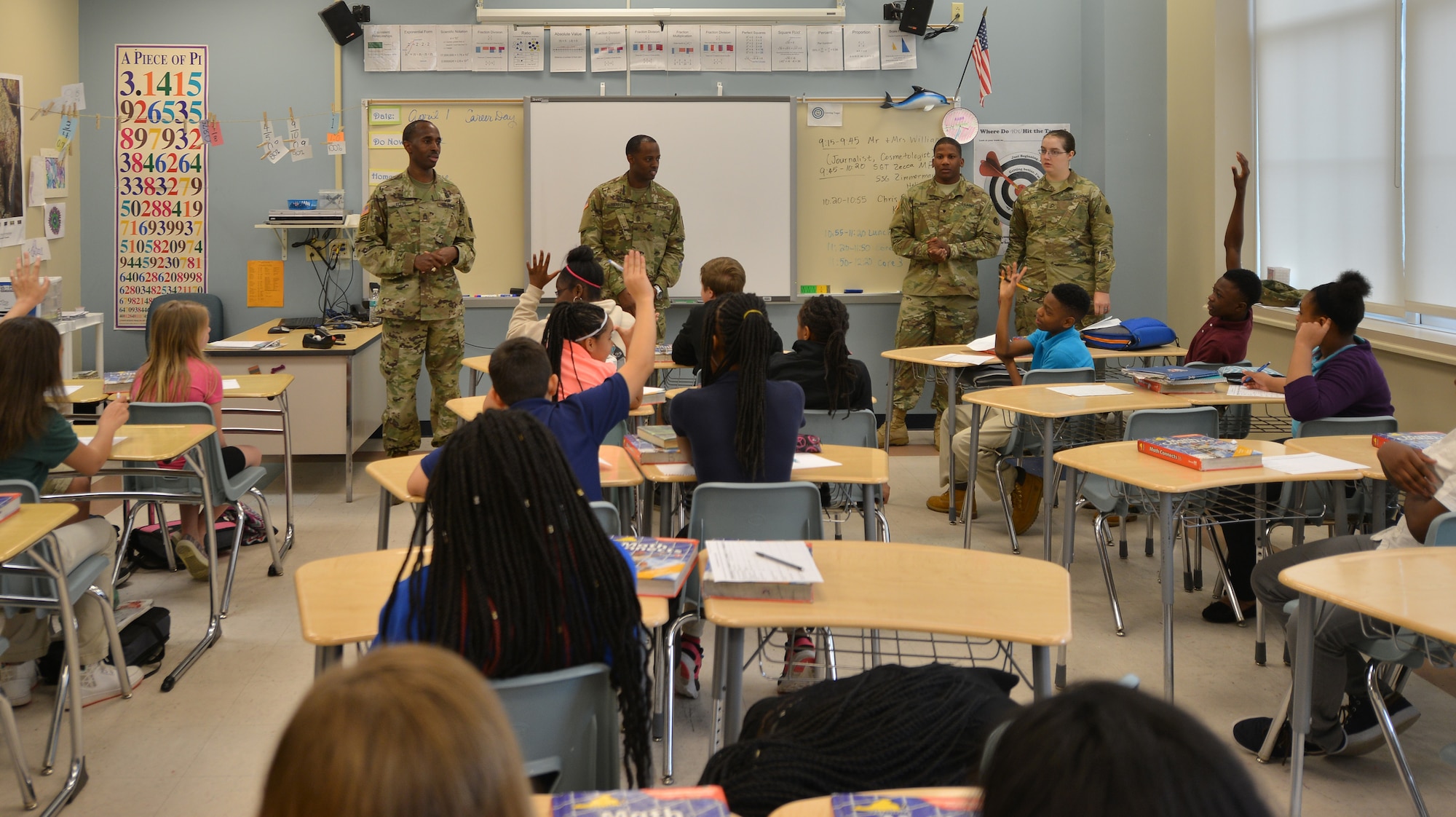 U.S. Soldiers with the 7th Transportation Brigade (Expeditionary) answer students’ questions about careers in the Army during career day at Booker T. Washington Middle School in Newport News, Va., April 1, 2016. The Soldiers detailed not only what their jobs entailed, but what it takes to be a Soldier. (U.S. Air Force photo by Staff Sgt. Natasha Stannard)