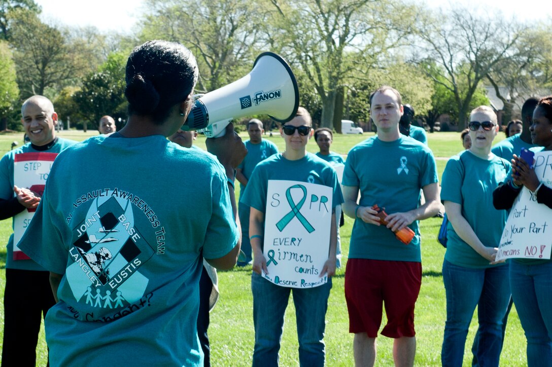 Community members from Joint Base Langley-Eustis gather at Memorial Park during a Sexual Assault Awareness Month rally at Langley Air Force Base, Va., April 4, 2016.  Each year, the JBLE Sexual Assault Prevention and Response team host events throughout the month to raise awareness within the JBLE community in an effort to prevent sexual violence. (U.S. Air Force photo by Senior Airman R. Alex Durbin)