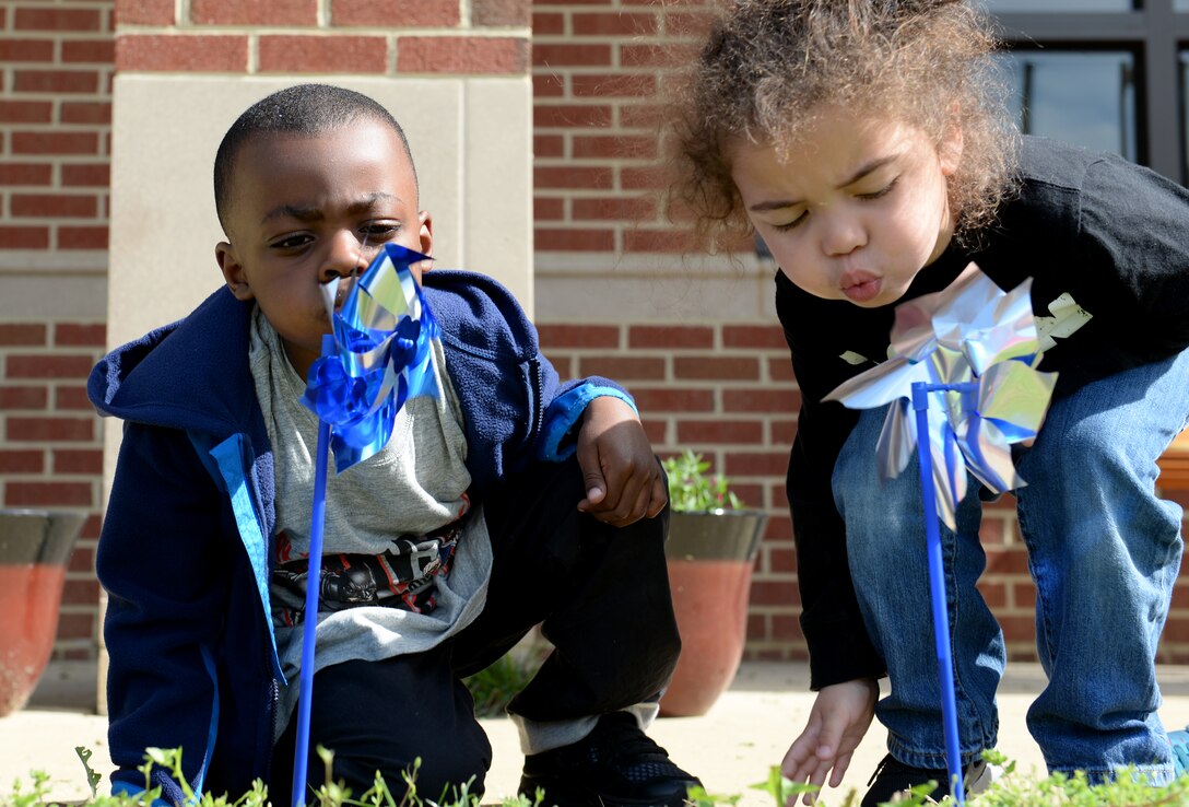 Children play with pinwheels in support of National Child Abuse Prevention Month at Langley Air Force Base, Va., April 1, 2016. According to the Department of Health and Human Services, child abuse and neglect is the cause of more than 1,000 deaths each year in the U.S. (U.S. Air Force photo by Airman 1st Class Kaylee Dubois)