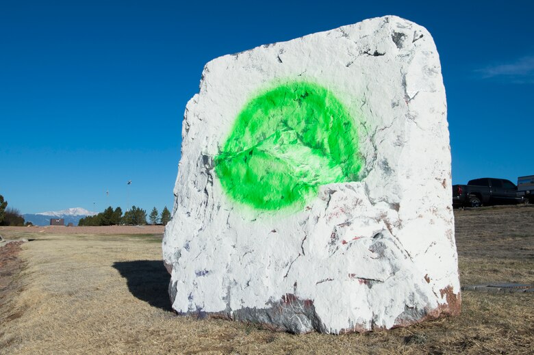 The Schriever Air Force Base Spirit Rock reflects the Air Force's new violence prevention program, Green Dot, Tuesday, April 5, 2016. The Air Force's goal for Green Dot is to empower its Airmen and give them the confidence to prevent violence before it happens. For more information about Green Dot, visit www.livethegreendot.com. (U.S. Air Force photo/2nd Lt. Darren Domingo)