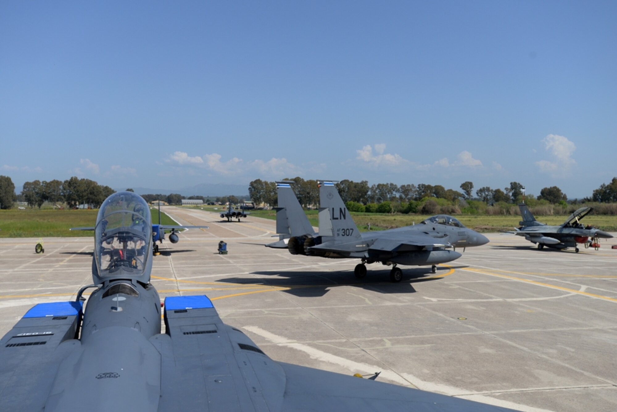 U.S. Air Force F-15E Strike Eagles assigned to the 492nd Fighter Squadron, Royal Air Force Lakenheath, England, taxi to the runway, April 4, 2016, during exercise INIOHOS 16 at Andravida Air Base, Greece. Twelve F-15E aircraft from the squadron and approximately 260 U.S. Air Force Airmen are participating in the training event that also includes air forces from Greece and Israel. (U.S. Air Force photo by Tech. Sgt. Eric Burks/Released)