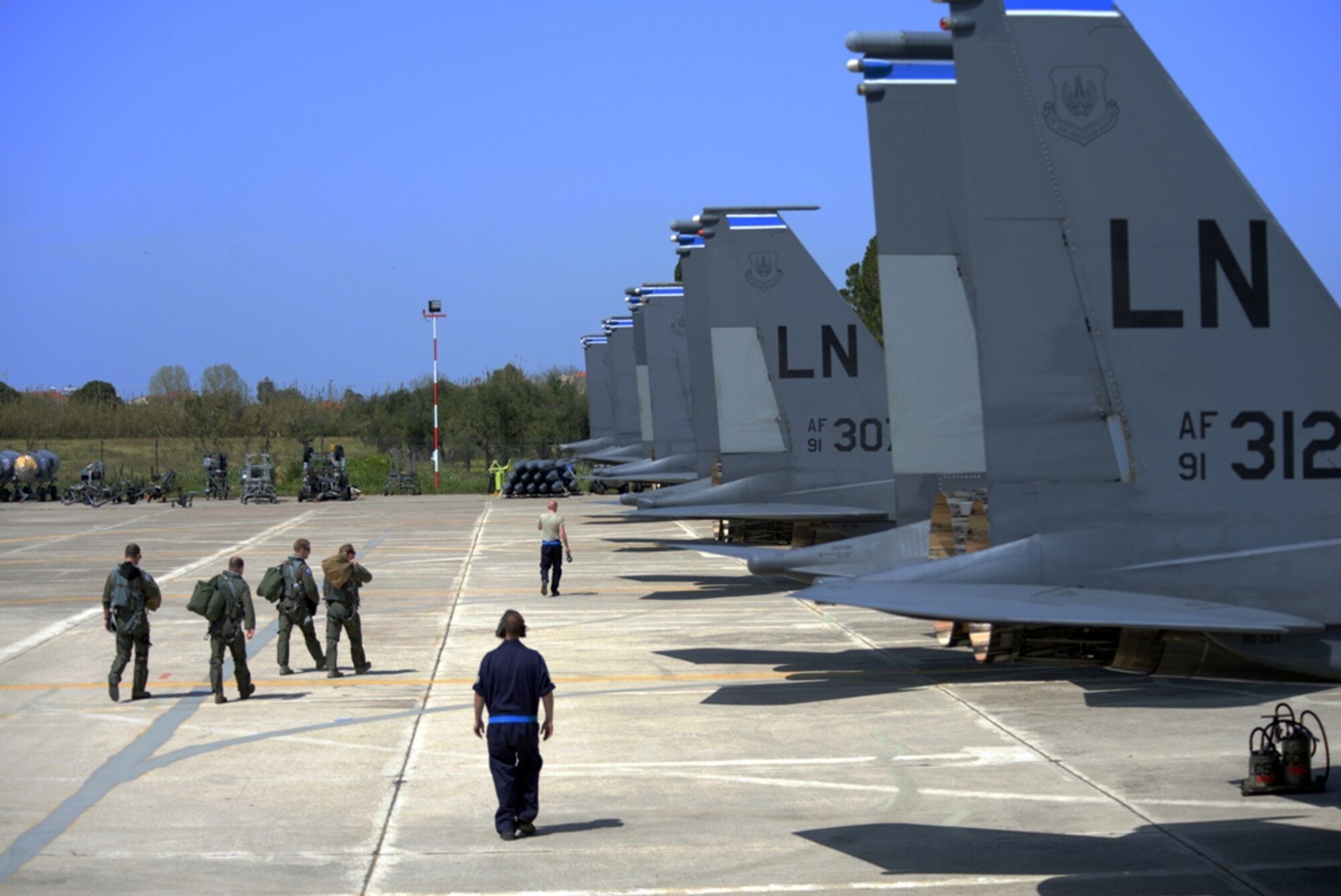 Pilots, weapon systems officers, and maintenance Airmen from the 48th Fighter Wing, Royal Air Force Lakenheath, England, step to U.S. Air Force F-15E Strike Eagle aircraft for a sortie launch, April 4, 2016, during exercise INIOHOS 16 at Andravida Air Base, Greece. INIOHOS 16 is a Hellenic air force-hosted exercise that enhances interoperability, capabilities, and skills amongst allied and partner air forces in the accomplishment of joint operations and air defenses, in order to maintain joint readiness and reassure our regional allies and partners. (U.S. Air Force photo by Tech. Sgt. Eric Burks/Released)