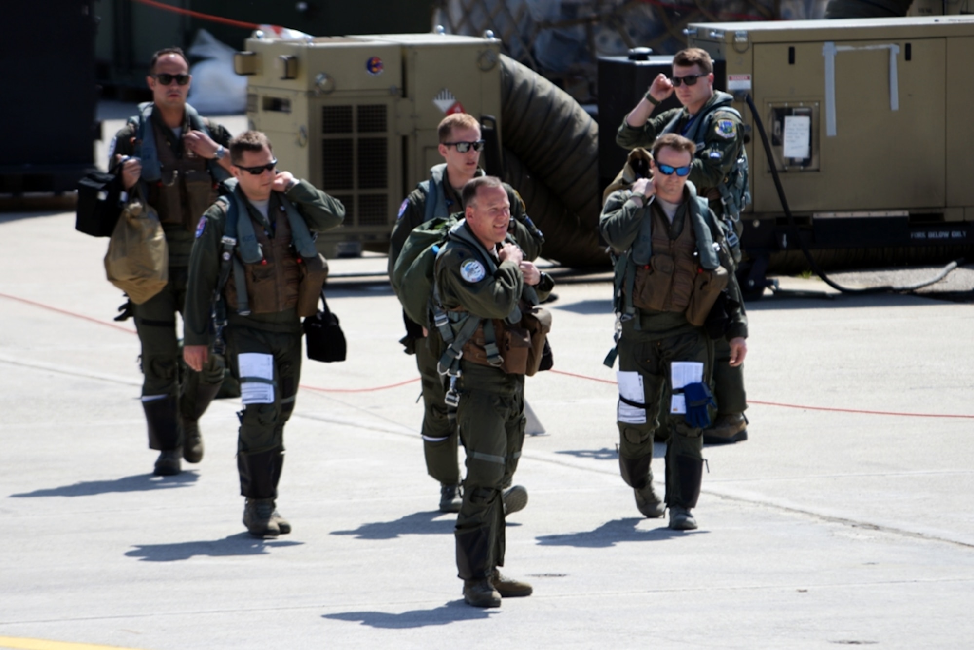 Pilots and weapon systems officers assigned to the 492nd Fighter Squadron, Royal Air Force Lakenheath, England, step to their F-15E Strike Eagle aircraft for a sortie launch, April 4, 2016, during exercise INIOHOS 16 at Andravida Air Base, Greece. Twelve F-15E aircraft and approximately 260 U.S. Air Force Airmen are participating in the training event that also includes air forces from Greece and Israel. (U.S. Air Force photo by Tech. Sgt. Eric Burks/Released)