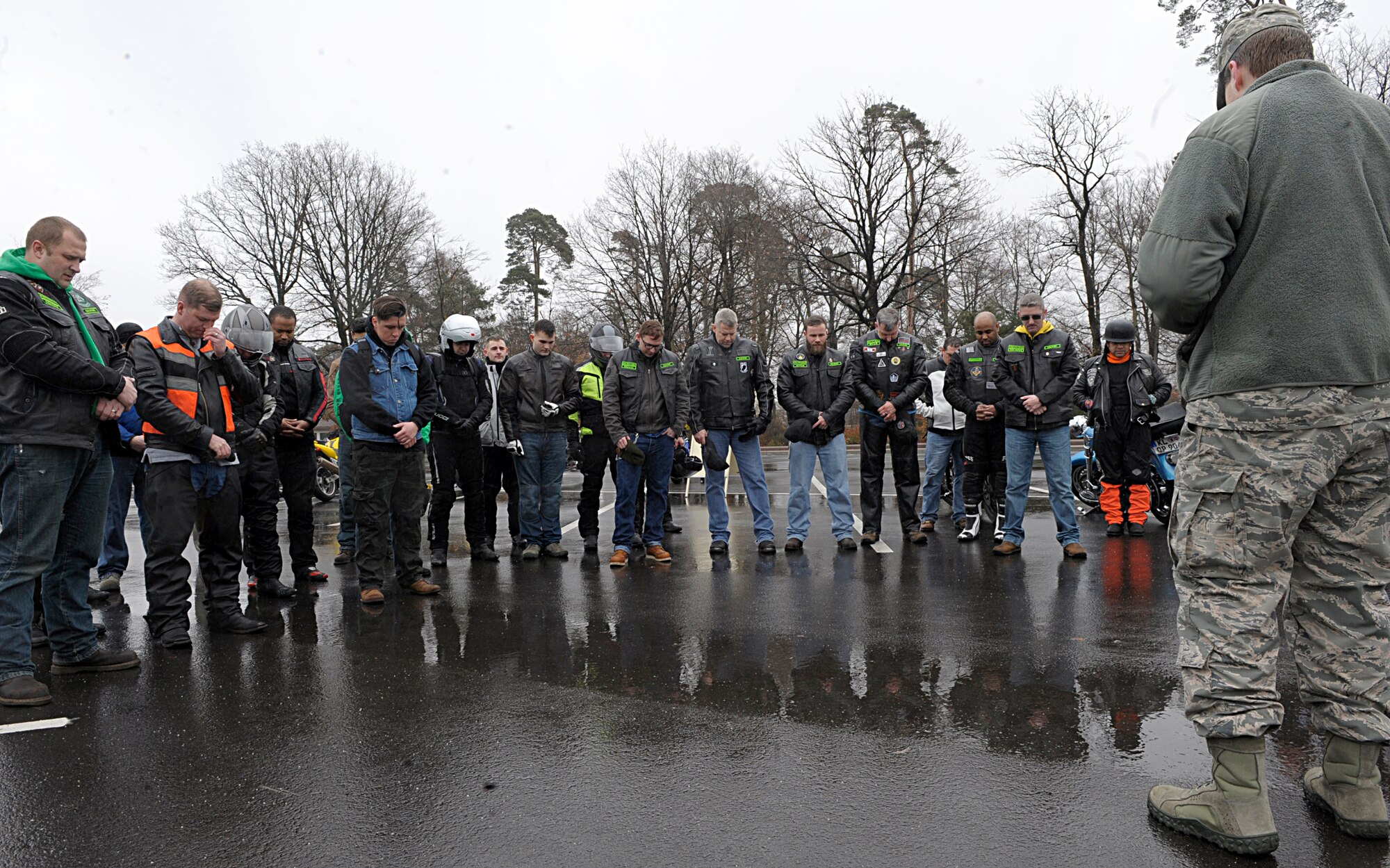 Chaplain (Capt.) Matthew Streett, 86th Airlift Wing, prays for a group of motorcyclists April 1, 2016, at Ramstein Air Base, Germany. The 86th AW Safety office organized two group rides for motorcyclists after the annual pre-season motorcycle safety briefing. (U.S. Air Force photo/Staff Sgt. Timothy Moore)