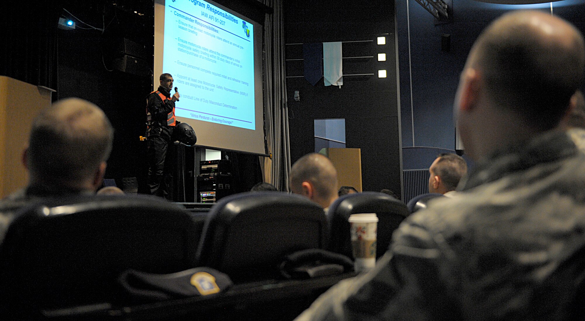 Lt. Col. Paul Silas, 86th Civil Engineer Squadron commander, talks to other motorcycle riders during an annual pre-season motorcycle safety briefing April 1, 2016, at Ramstein Air Base, Germany. As a fellow motorcyclist, Silas warned riders about being in the right mindset while riding. The 86th Airlift Wing Safety office encourages motorcyclists to get information and guidance from more experienced riders. (U.S. Air Force photo/Staff Sgt. Timothy Moore)