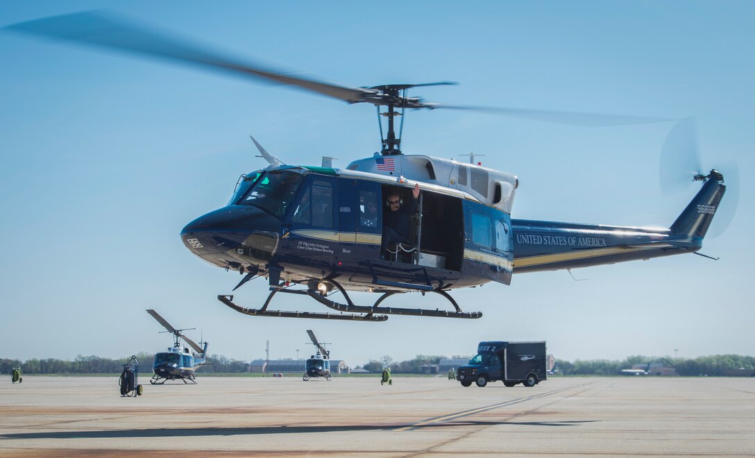 Gen. Abidin Ünal, Turkish Air Force Chief of Staff, waves during takeoff in a UH-1N Iroquois at Joint Base Andrews, Md., April 6, 2016. Ünal flew with the 1st Helicopter Squadron during a U.S. visit to strengthen U.S – Turkey relations. (U.S. Air Force photo by Senior Airman Ryan J. Sonnier/RELEASED)