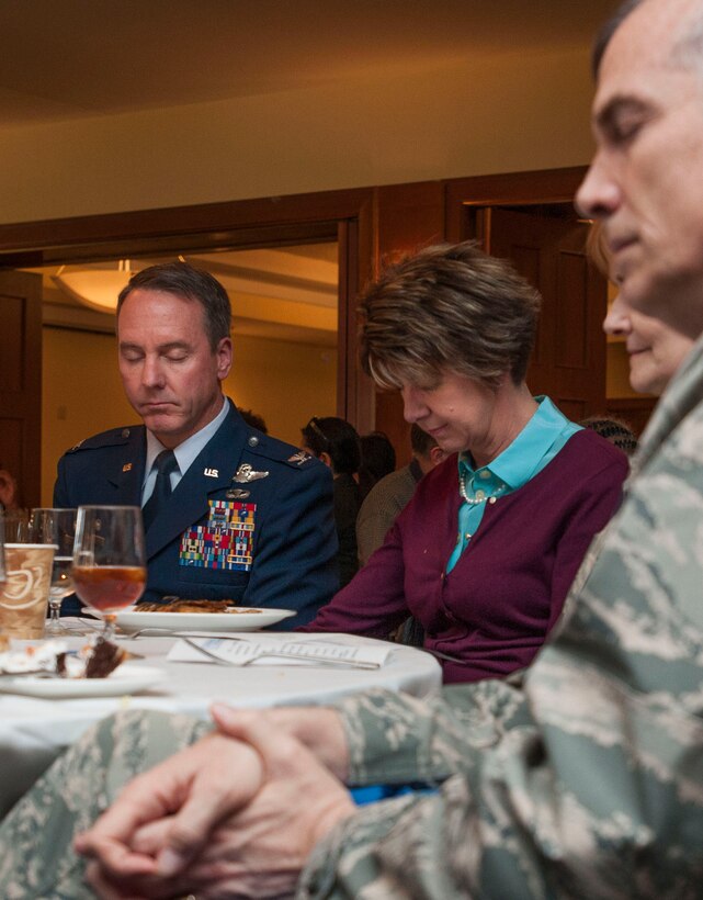 Members of Joint Base Andrews bow their heads in prayer at the National Prayer Luncheon here April 5, 2016. Guest speaker Chaplain (Brig. Gen.) Steven A. Schaick, U. S. Air Force’s Deputy Chief of Chaplains, addressed approximately 80 JBA members. The National Prayer luncheon is modeled after the National Prayer Breakfast first attended by former President Dwight D. Eisenhower in 1953. (U.S. Air Force photo by Airman 1st Class Rustie Kramer/Released) 