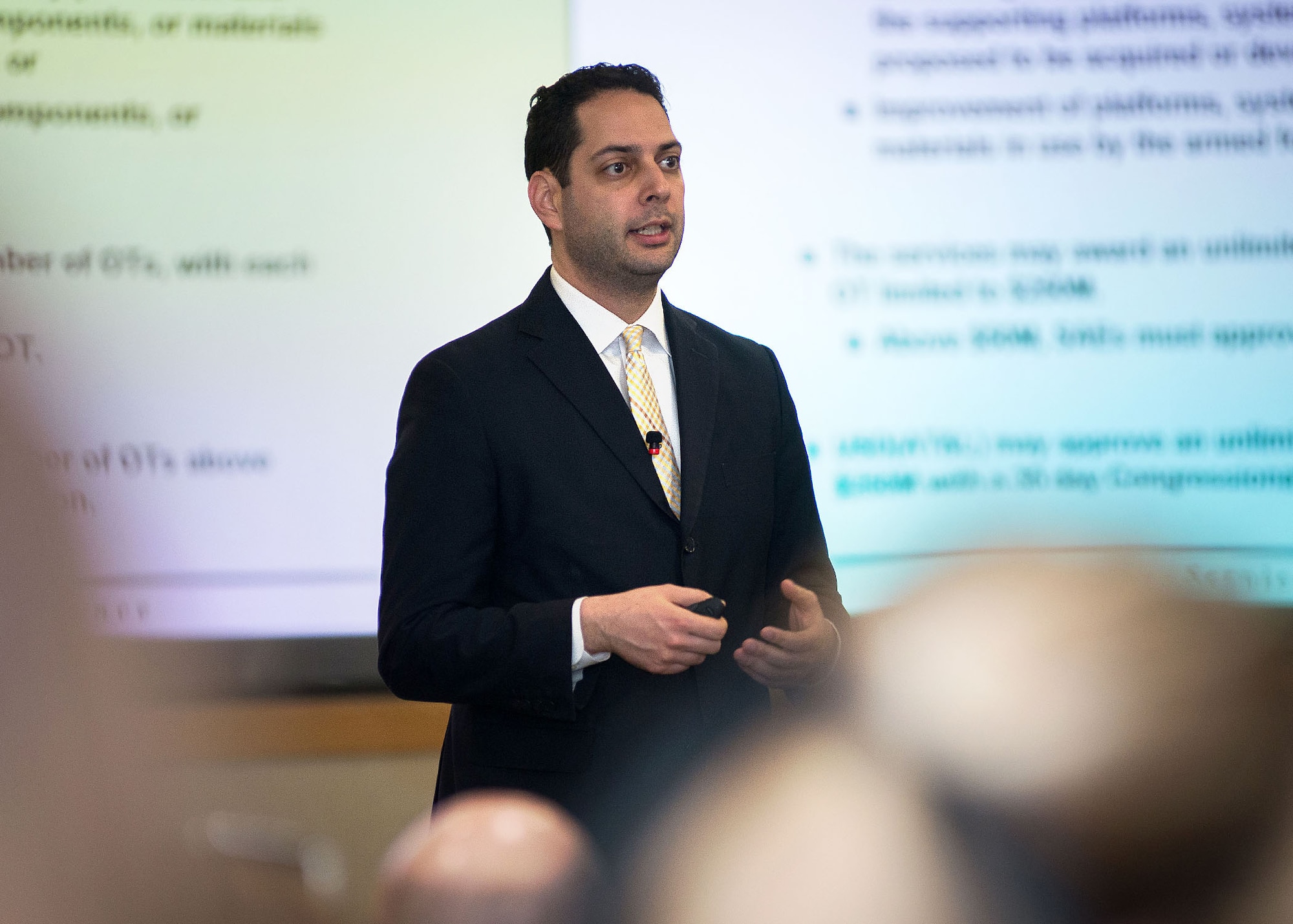 Dr. Camron Gorguinpour, director of Transformational Innovation, Office of the Assistant Secretary of the Air Force for Acquisition, speaks to members of the workforce at Hanscom Air Force Base, Mass., at the conference center March 31. Gorguinpour spoke about flexibility in acquisition, specifically addressing Other Transaction Authority. (U.S. Air Force photo by Mark Herlihy)