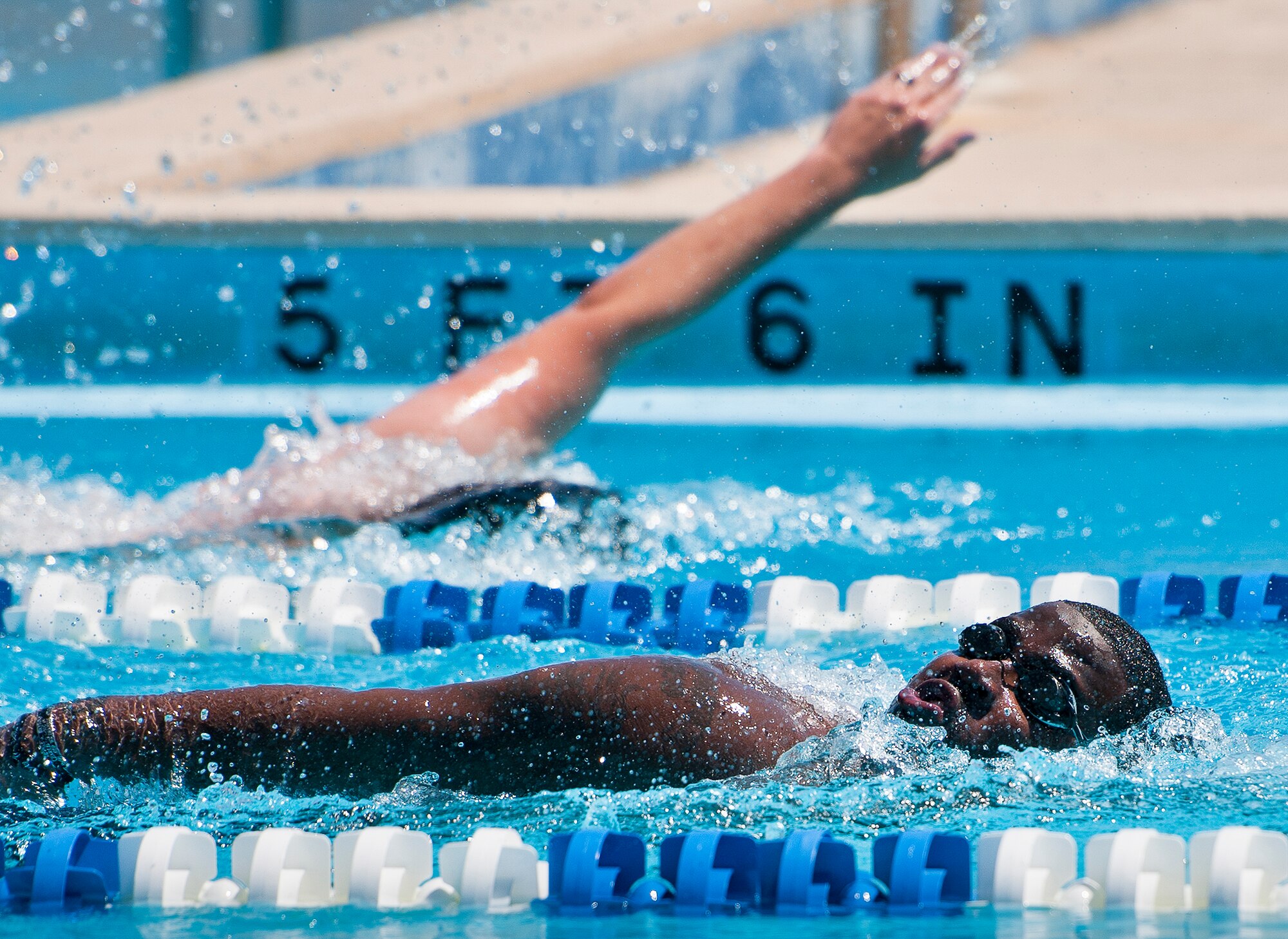 Jason Curry, a Warrior CARE attendee, takes in a breath of air during a morning swim session at the adaptive sports camp at Eglin Air Force Base, Fla., April 5.  The base hosts the week-long Wound Warrior Care event that helps recovering wounded, ill and injured military members through specific hand-on rehabilitative training.  (U.S. Air Force photo/Samuel King Jr.)
