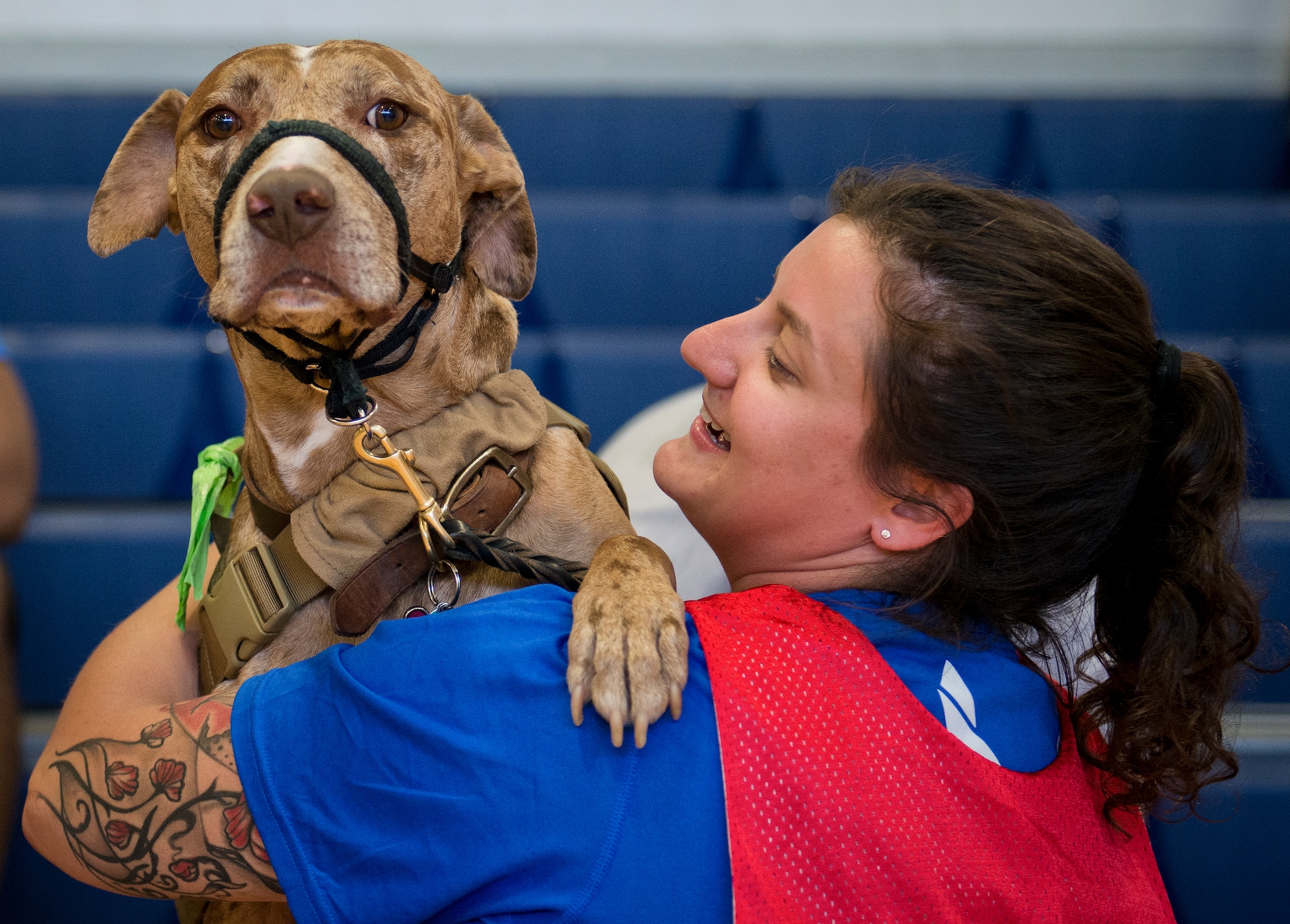 Hanna Stulberg, a Warrior Care attendee, and her service dog, Valhalla, share a moment during the adaptive sports camp at Eglin Air Force Base, Fla., April 5.  The base hosts the week-long Wound Warrior Care event that helps recovering wounded, ill and injured military members through specific hand-on rehabilitative training.  (U.S. Air Force photo/Samuel King Jr.)