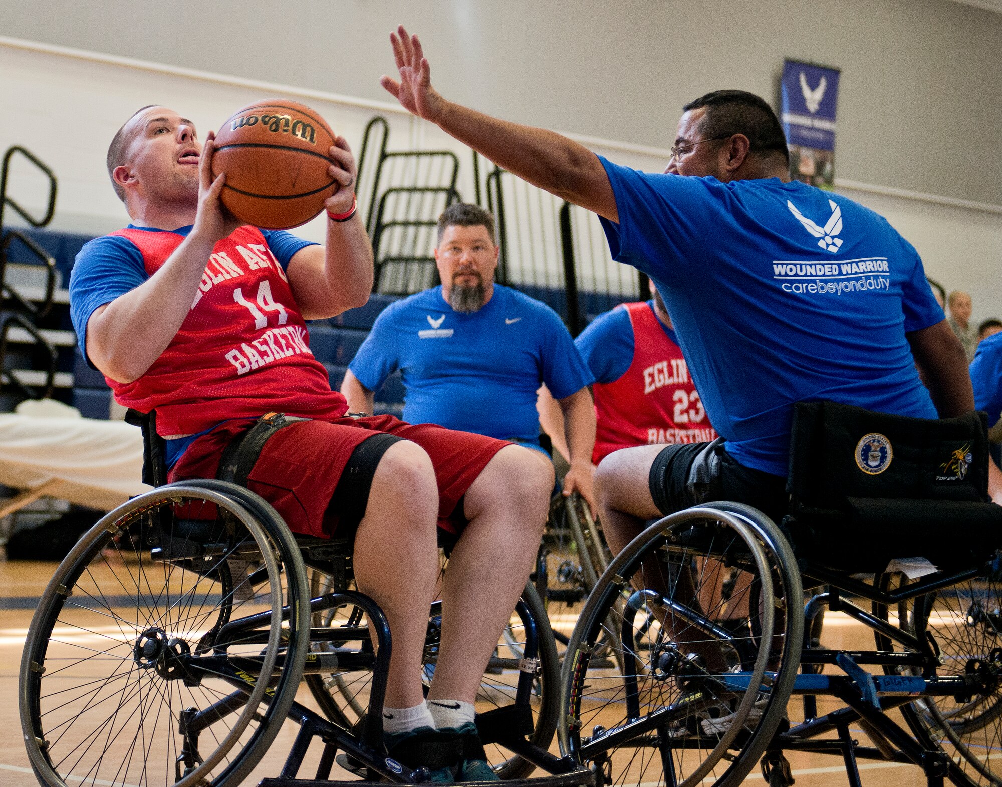 A Warrior Care attendee takes a shot at the basket during a wheelchair basketball session at the adaptive sports camp at Eglin Air Force Base, Fla., April 5.  The base hosts the week-long Wound Warrior Care event that helps recovering wounded, ill and injured military members through specific hand-on rehabilitative training.  (U.S. Air Force photo/Samuel King Jr.)