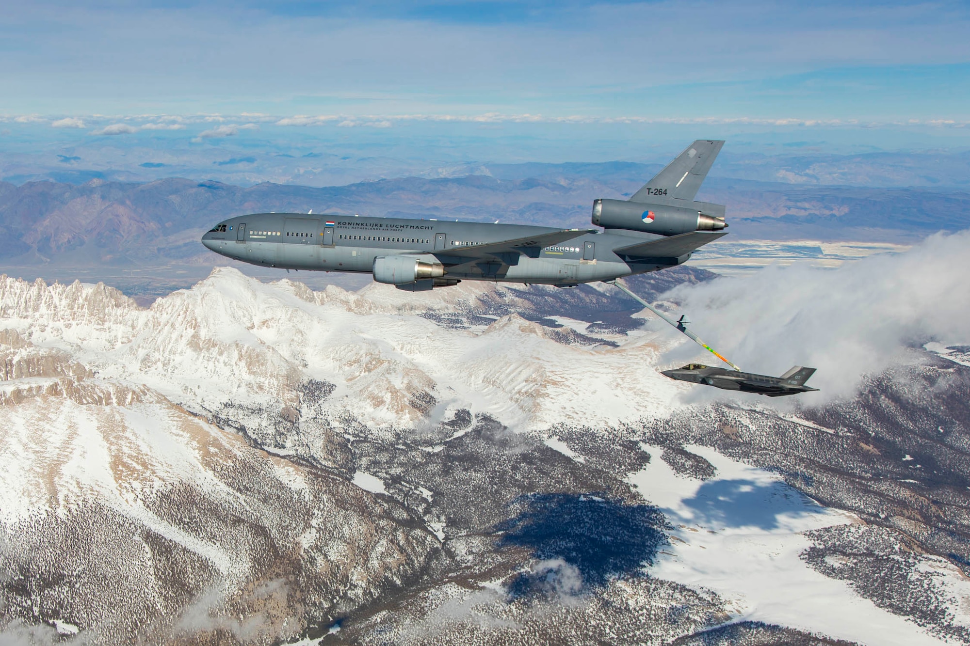 A Royal Netherlands Air Force KDC-10 tanker from RNLAF  334 Squadron refuels a RNLAF F-35 Joint Strike Fighter over the Sierra Nevada  mountain range March 31. This is the first time an F-35 made contact with a  Dutch aerial refueler in an effort to certify the tanker for all F-35A users.  The fifth-generation fighter is from the RNLAF's 323rd Squadron, which  conducts operational test and evaluation together with the US, UK and  Australia here at Edwards. (U.S. Air Force photo by Chris Okula)