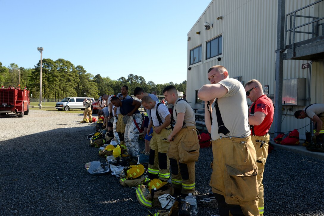 Airmen from Connecticut, Maine, New Jersey, Rhode Island and Vermont Air National Guard Fire Departments prepare to perform a live aircraft fire training exercise at 165th Airlift Wing's Regional Fire Training Facility in Savannah, Ga. on April 4th, 2016. (U.S. Air National Guard photo by Tech. Sgt. Andrew J. Merlock/Released)