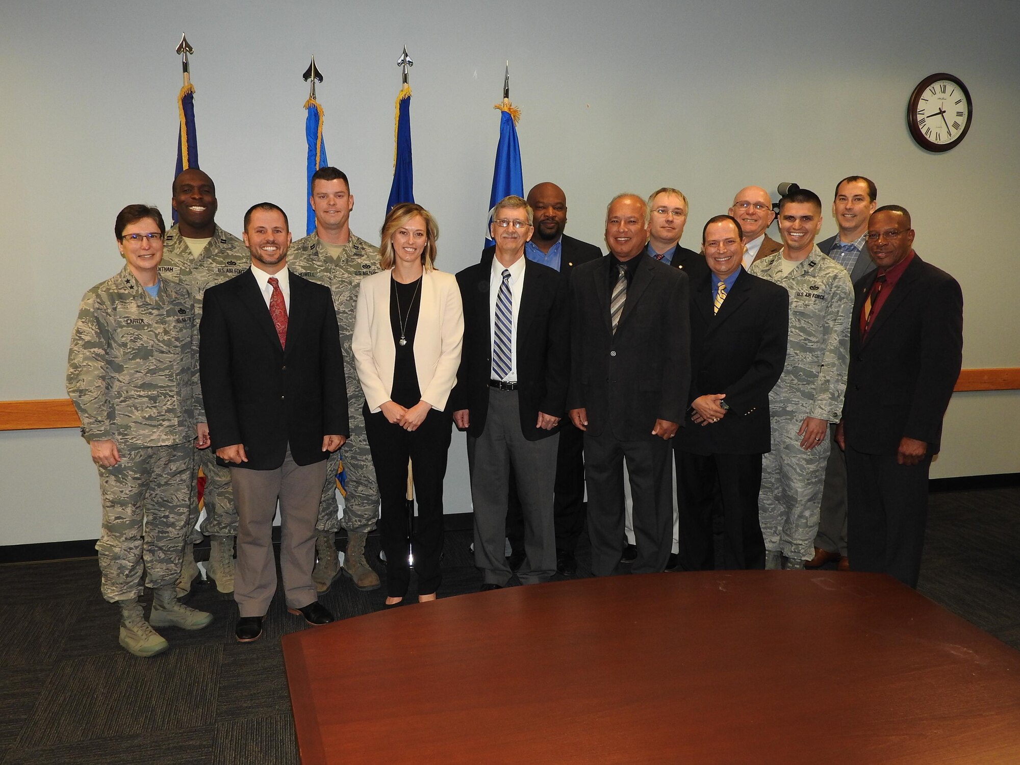 After announcing AFCEC's Activity Integration Team recently received honors as the second runner-up for the 2014 Chief of Staff Team Excellence Award, Maj. Gen. Theresa Carter, Air Force Installation and Mission Support Center commander, poses for a photo with the team April 1, 2016. (U.S. Air Force photo/Steve Warns/Released)