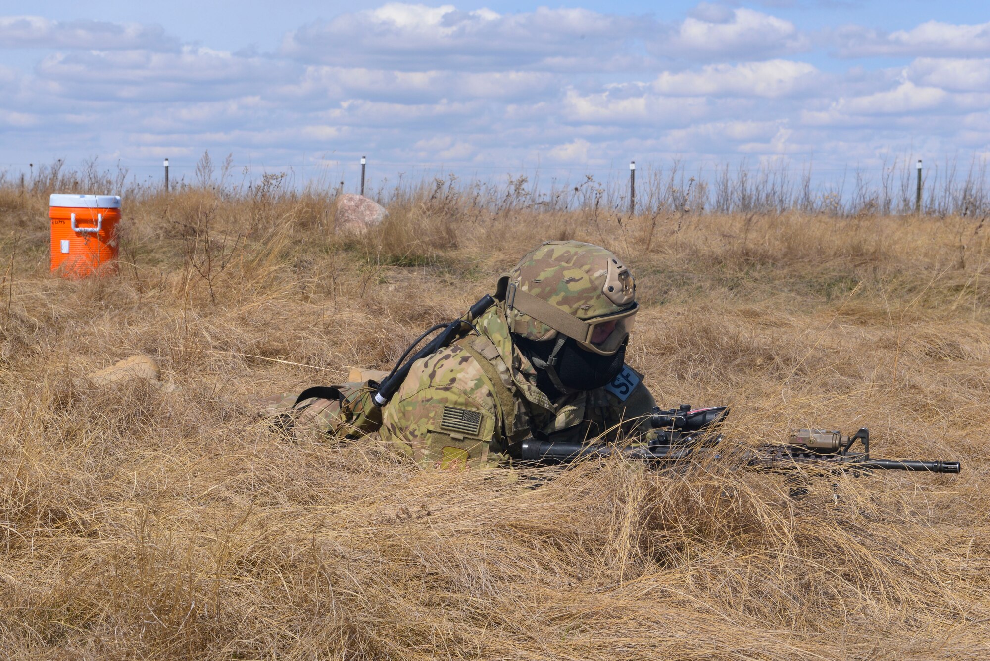 A convoy response force member assigned to the 791st Missile Security Forces Squadron, sets up 360-degree security around a simulated resource during a training exercise in Garrison, N.D., March 30, 2016. CRF Airmen participated in three iterations of training to prepare for the Air Force Global Strike Command Road Warrior exercise. (U.S. Air Force photo/Airman 1st Class Jessica Weissman)