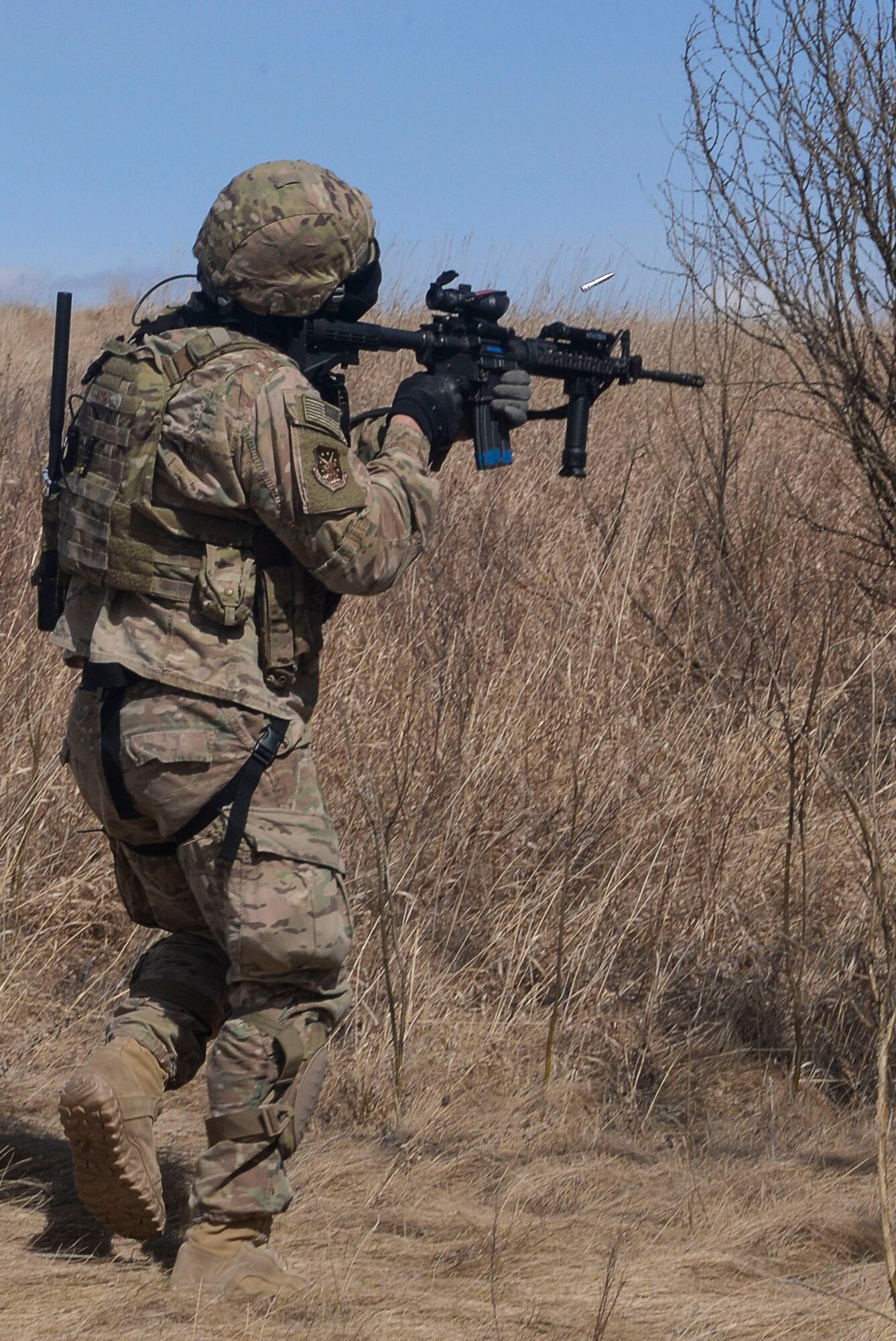 Senior Airman Joseph Stover, a convoy response force member assigned to the 791st Missile Security Forces Squadron, fires a Simunition round at the opposition force during a training exercise in Garrison, N.D., March 30, 2016. CRF Airmen participated in three iterations of training to prepare for the Air Force Global Strike Command Road Warrior. (U.S. Air Force photo/Airman 1st Class Jessica Weissman)
