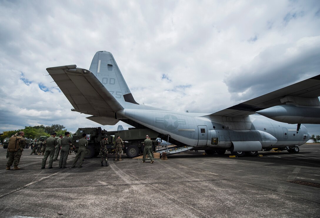 U.S. Marine Corps and Philippine Air Force members watch a M142 High Mobility Artillery Rocket Systems load during Balikatan 16 at Clark Air Base, Philippines, April 6, 2016. After loading, the crew of Marine Aerial Refueler Transport Squadron 152, Marine Aircraft Group 12, 1st Marine Aircraft Wing flew the HIMARS for the first time in the Philippines. This year marks the 32nd iteration of Balikatan where U.S. service members continue to work “shoulder-to-shoulder” with members of the Armed Forces of the Philippines to increase combined readiness to crises and conflict across the Indo-Asia-Pacific region.