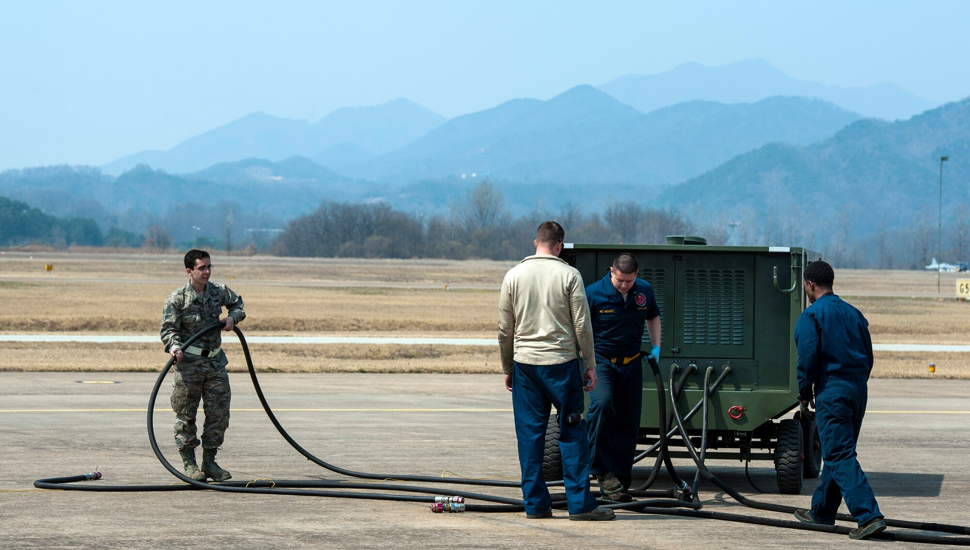 Airmen from the 80th Aircraft Maintenance Unit, Kunsan Air Base, Republic of Korea, prepare to perform preflight maintenance for an F-16 Fighting Falcon during Buddy Wing 16-3 at Jungwon Air Base, ROK, March 30, 2016. Buddy Wing training, held multiple times a year, polishes the ability of the Republic of Korea and U.S. pilots to train and operate as a combined force. (U.S. Air Force photo by Staff Sgt. Nick Wilson/Released)