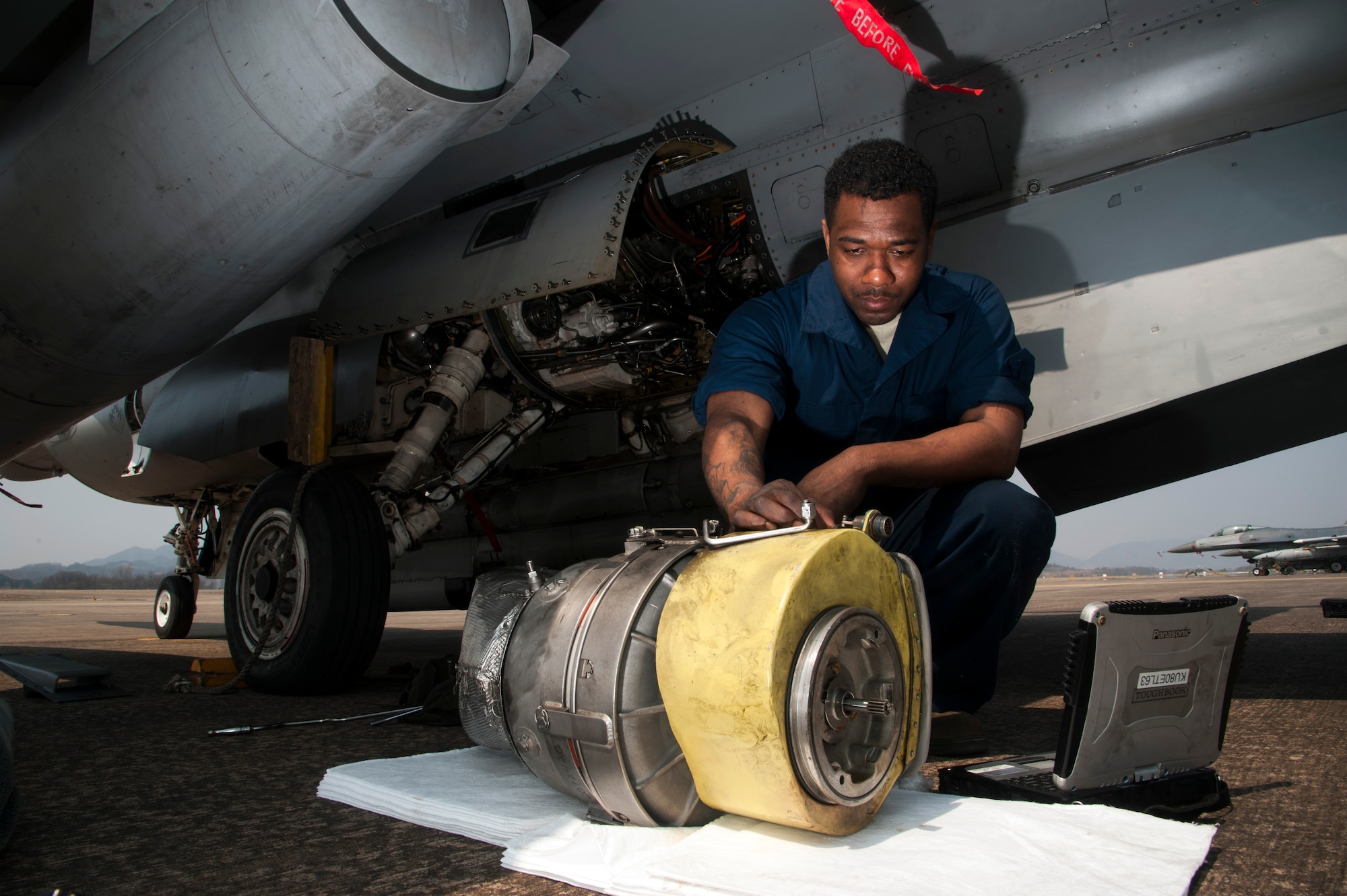 Staff Sgt. Decedrick Randle, 80th Aircraft Maintenance Unit electrical and environmental specialist, troubleshoots an engine starting issue during Buddy Wing 16-3 at Jungwon Air Base, ROK, March 30, 2016. Buddy Wing training, held multiple times a year, polishes the ability of the Republic of Korea and U.S. pilots to train and operate as a combined force. (U.S. Air Force photo by Staff Sgt. Nick Wilson/Released)
