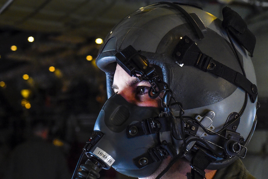 Air Force Tech. Sgt. John Beal follows his flight checklist during a training mission over Texas, March 29, 2016. Beal is an evaluator loadmaster assigned to the 317th Airlift Group evaluator loadmaster. Air Force photo by Senior Airman Keith James