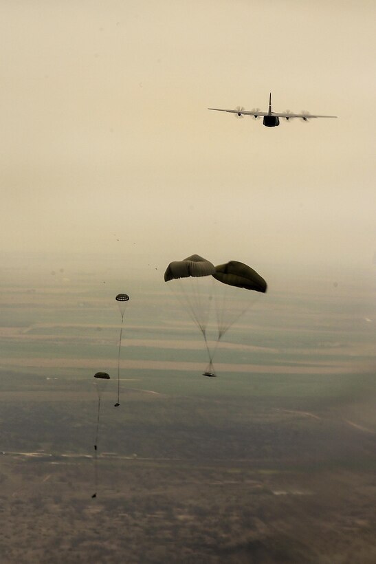 A C-130J Hercules aircraft drops simulated cargo loads during a training mission over a drop zones at Dyess Air Force Base, Texas, March 29, 2016. Air Force photo by Senior Airman Keith James