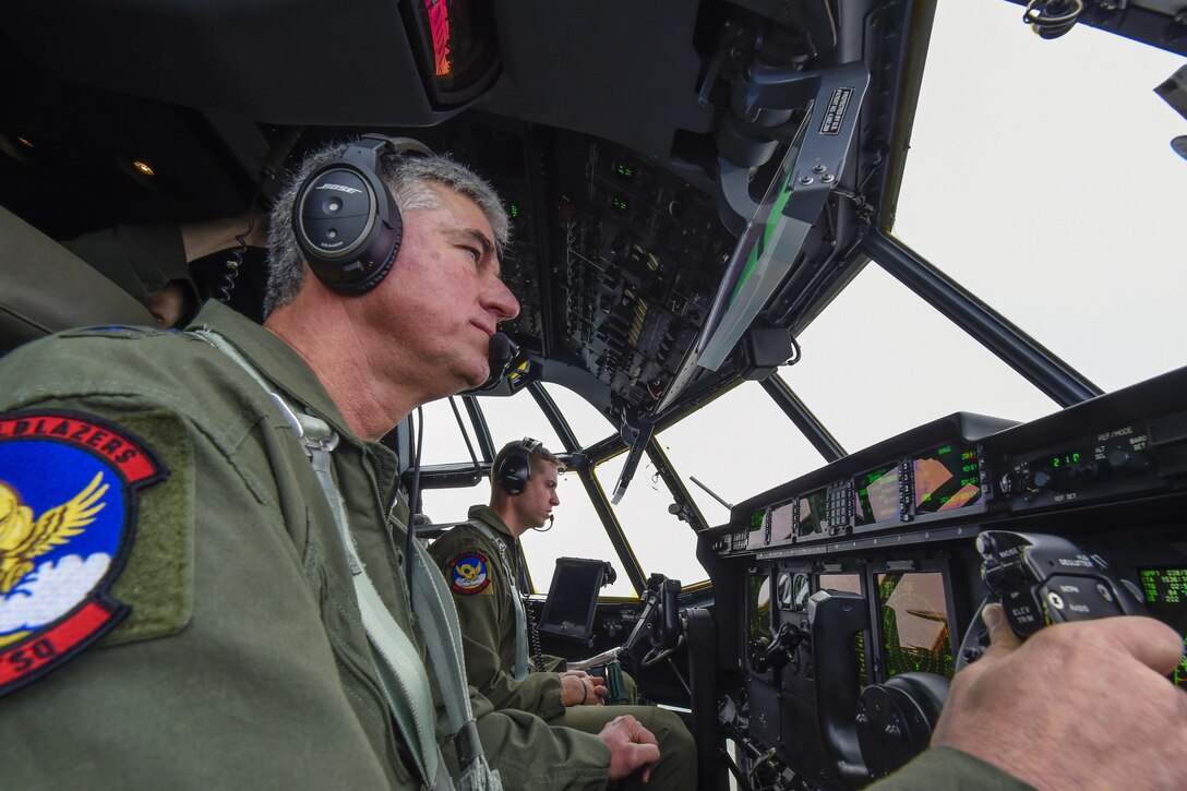 Air Force Lt. Gen. Sam Cox, foreground, commander, 18th Air Force, flies a C-130J Hercules aircraft during a training mission over Texas, March 30, 2016. Air Force photo by Senior Airman Keith James