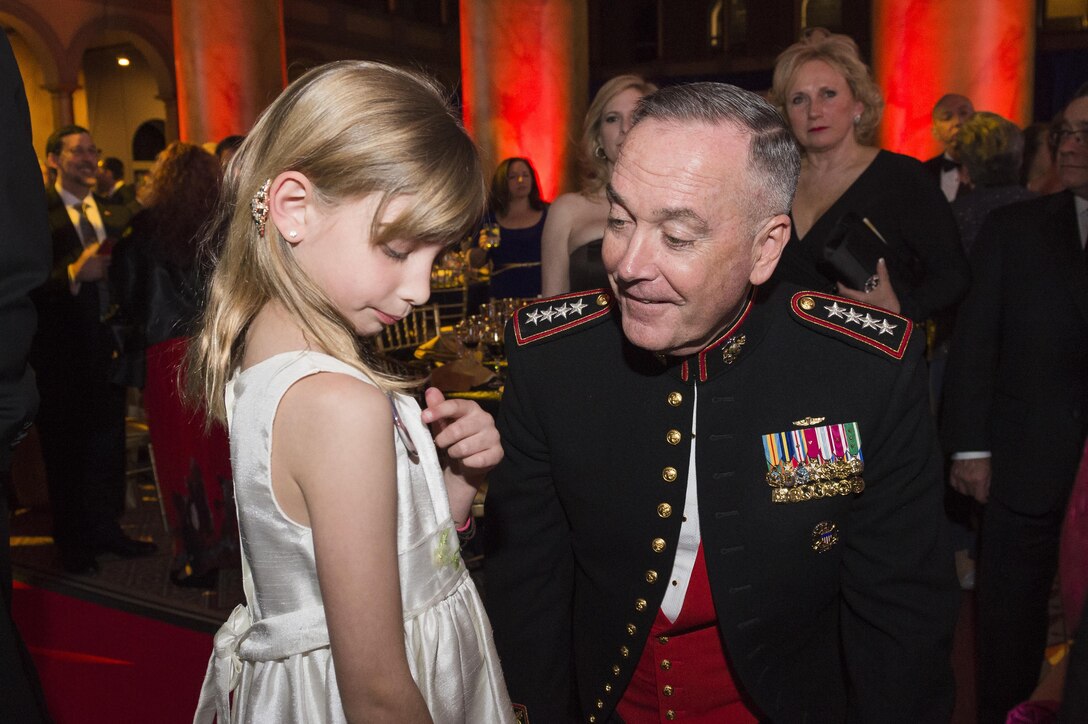 Marine Corps Gen. Joe Dunford, chairman of the Joint Chiefs of Staff, speaks to a military child during the Tragedy Assistance Program for Survivors 2016 Honor Guard Gala in Washington, D.C., April 6, 2016. During the event, Gen. Dunford was presented the TAPS Honor Guard Gala Military Award, accepting it on behalf of the men and women serving in our Armed Forces. DoD photo by Army Staff Sgt. Sean K. Harp