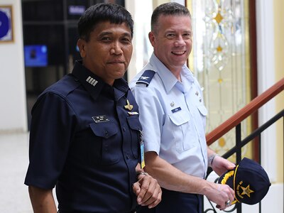 Col. Jeremy Horn, commander, 194th Wing, Washington Air National Guard, and Gp. Cpt. Wasan Mangrod, Royal Thai Air Force on March 23, 2016 at the Royal Thai Air Force War College at Don Mueng Airbase in Bangkok, Thailand. The Washington National Guard senior leadership visited the Kingdom as part of the National Guard State Partnership Program. 