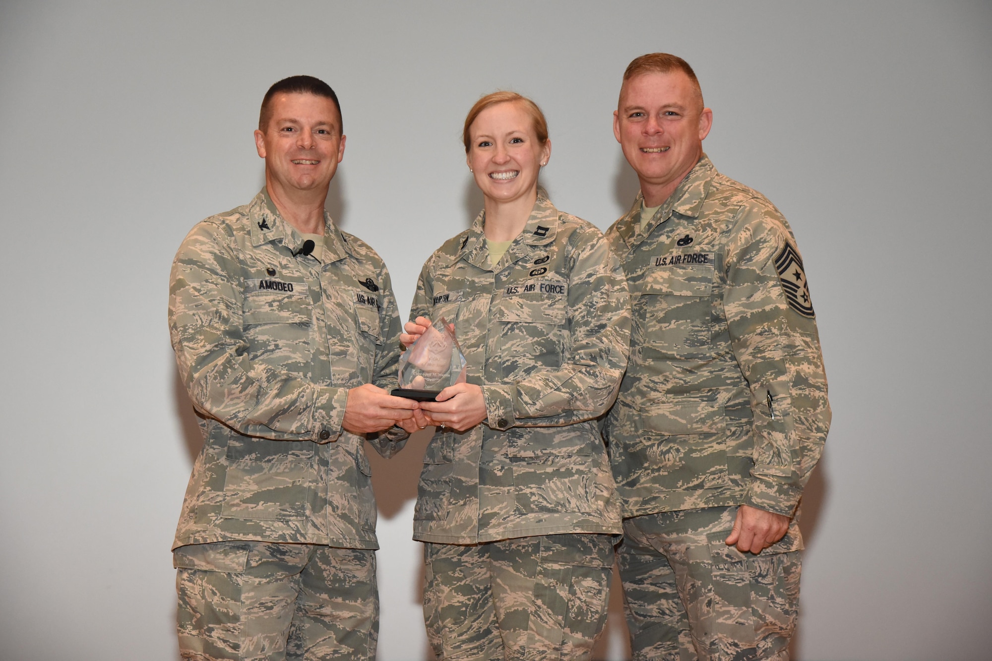 The 403rd Wing held its annual commander’s call at Welch Theater April 2, 2016, during the Unit Training Assembly. Col. Frank Amodeo, 403rd Wing Commander, presented awards to the 2015 quarterly and annual award winners. Capt. April Martin, 403rd Force Support Squadron, is the Company Grade Officer of the Year for 2015. (U.S. Air Force photo/Tech. Sgt. Ryan Labadens)  
