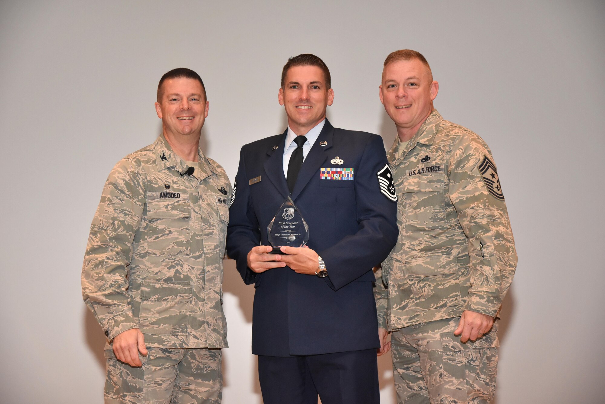 The 403rd Wing held its annual commander’s call at Welch Theater April 2, 2016, during the Unit Training Assembly. Col. Frank Amodeo, 403rd Wing Commander, presented awards to the 2015 quarterly and annual award winners. Master Sgt. Thomas Lassabe, 41st Aerial Port Squadron, is the First Sergeant of the Year for 2015. (U.S. Air Force photo/Tech. Sgt. Ryan Labadens)  