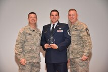 The 403rd Wing held its annual commander’s call at Welch Theater April 2, 2016, during the Unit Training Assembly. Col. Frank Amodeo, 403rd Wing Commander, presented awards to the 2015 quarterly and annual award winners. Master Sgt. Thomas Lassabe, 41st Aerial Port Squadron, is the First Sergeant of the Year for 2015. (U.S. Air Force photo/Tech. Sgt. Ryan Labadens)  