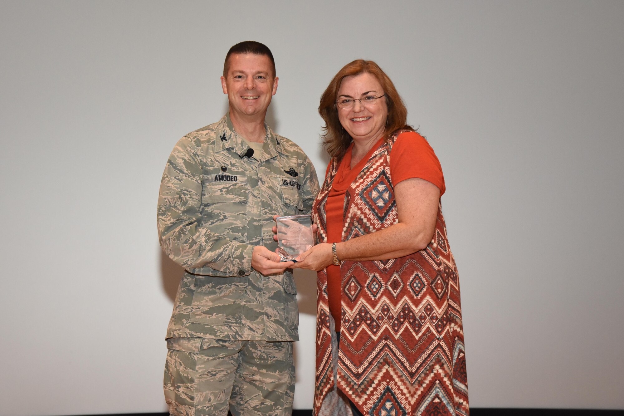 The 403rd Wing held its annual commander’s call at Welch Theater April 2, 2016, during the Unit Training Assembly. Col. Frank Amodeo, 403rd Wing Commander, presented awards to the 2015 quarterly and annual award winners. Wanda Bowman, is the Civilian of the Year for 2015. (U.S. Air Force photo/Tech. Sgt. Ryan Labadens)  
