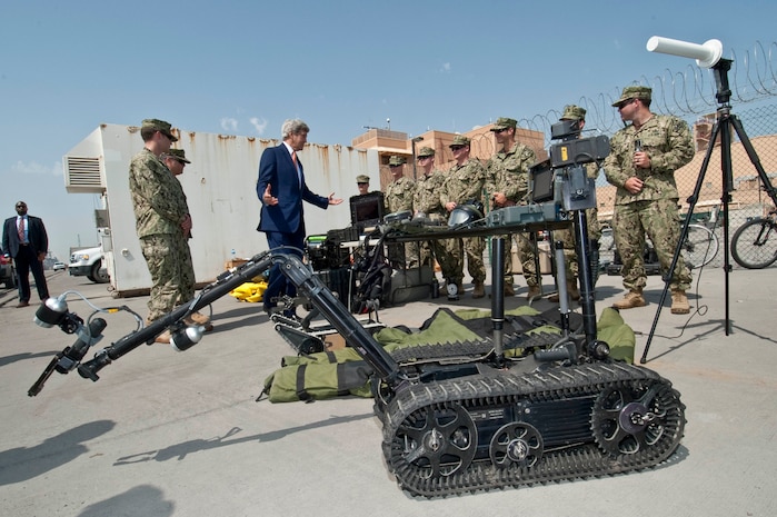 (April 07, 2016) U.S. Secretary of State John Kerry speaks with Sailors assigned to Task Force 56 about explosive ordnance equipment at Naval Support Activity Bahrain. The secretary visited Sailors of the U.S. 5th Fleet as part of his current travel to the region. 