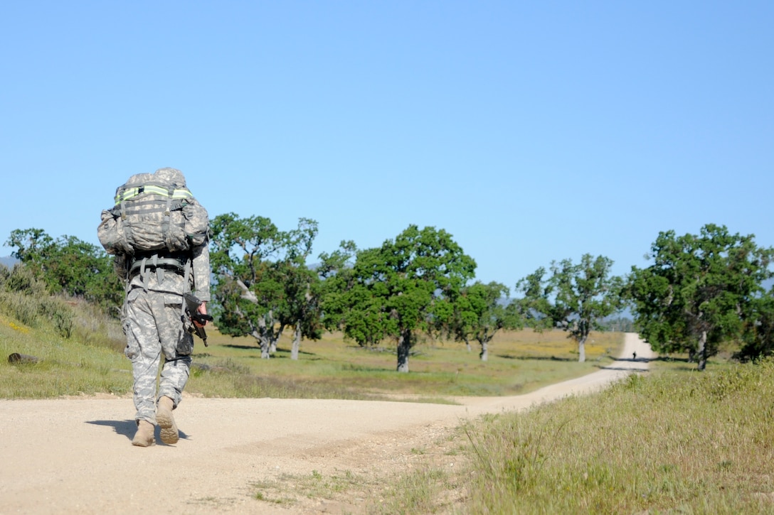 Soliders test their endurance during a ruck march at the U.S. Army Civil Affairs and Psychological Operations Command 2016 U.S. Army Best Warrior Competition at Fort Hunter Liggett, Calif., April 5, 2016. This year’s Best Warrior competition will determine the top noncommissioned officer and junior enlisted Soldier who will represent USACAPOC in the Army Reserve Best Warrior competition later this year. (U.S. Army photo by Spc. Khadijah Lutz-Wilcox, USACAPOC)