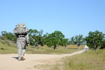 Soliders test their endurance during a ruck march at the U.S. Army Civil Affairs and Psychological Operations Command 2016 U.S. Army Best Warrior Competition at Fort Hunter Liggett, Calif., April 5, 2016. This year’s Best Warrior competition will determine the top noncommissioned officer and junior enlisted Soldier who will represent USACAPOC in the Army Reserve Best Warrior competition later this year. (U.S. Army photo by Spc. Khadijah Lutz-Wilcox, USACAPOC)