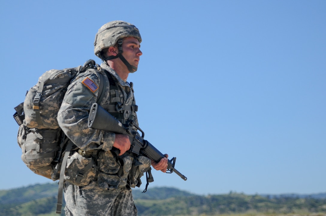 Sgt. Marshall Lane, from 352nd Civil Affairs Command, competes in a ruck march at the U.S. Army Civil Affairs and Psychological Operations Command 2016 U.S. Army Best Warrior Competition at Fort Hunter Liggett, Calif., April 5, 2016. This year’s Best Warrior competition will determine the top noncommissioned officer and junior enlisted Soldier who will represent USACAPOC in the Army Reserve Best Warrior competition later this year. (U.S. Army photo by Spc. Khadijah Lutz-Wilcox, USACAPOC)