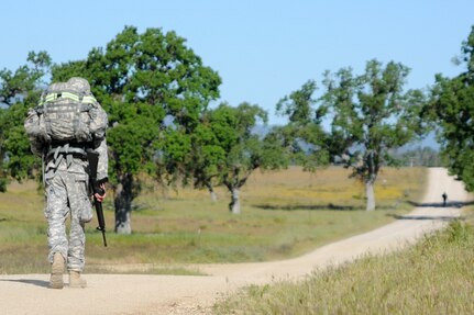 Soliders test their endurance during a ruck march at the U.S. Army Civil Affairs and Psychological Operations Command 2016 U.S. Army Best Warrior Competition at Fort Hunter Liggett, Calif., April 5, 2016. This year’s Best Warrior competition will determine the top noncommissioned officer and junior enlisted Soldier who will represent USACAPOC in the Army Reserve Best Warrior competition later this year. (U.S. Army photo by Spc. Khadijah Lutz-Wilcox, USACAPOC)