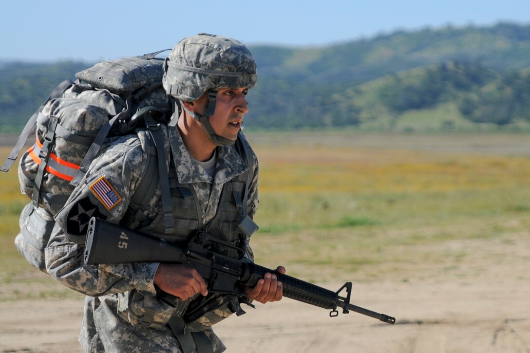 Staff Sgt. Antonio Palomera, from 152nd Theater Information Operations Group, competes in a ruck march at the U.S. Army Civil Affairs and Psychological Operations Command 2016 U.S. Army Best Warrior Competition at Fort Hunter Liggett, Calif., April 5, 2016. This year’s Best Warrior competition will determine the top noncommissioned officer and junior enlisted Soldier who will represent USACAPOC in the Army Reserve Best Warrior competition later this year. (U.S. Army photo by Spc. Khadijah Lutz-Wilcox, USACAPOC)