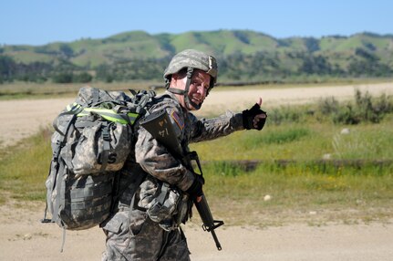 Staff sgt. Jonathan Stamper, from 1st Training Brigade, competes in a ruck march at the U.S. Army Civil Affairs and Psychological Operations Command 2016 U.S. Army Best Warrior Competition at Fort Hunter Liggett, Calif., April 5, 2016. This year’s Best Warrior competition will determine the top noncommissioned officer and junior enlisted Soldier who will represent USACAPOC in the Army Reserve Best Warrior competition later this year. (U.S. Army photo by Spc. Khadijah Lutz-Wilcox, USACAPOC)