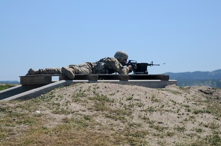 A Soldier fires a rifle at the U.S. Army Civil Affairs and Psychological Operations Command 2016 U.S. Army Best Warrior Competition at Fort Hunter Liggett, Calif., April 5, 2016. This year’s Best Warrior competition will determine the top noncommissioned officer and junior enlisted Soldier who will represent USACAPOC in the Army Reserve Best Warrior competition later this year. (U.S. Army photo by Spc. Khadijah Lutz-Wilcox, USACAPOC)