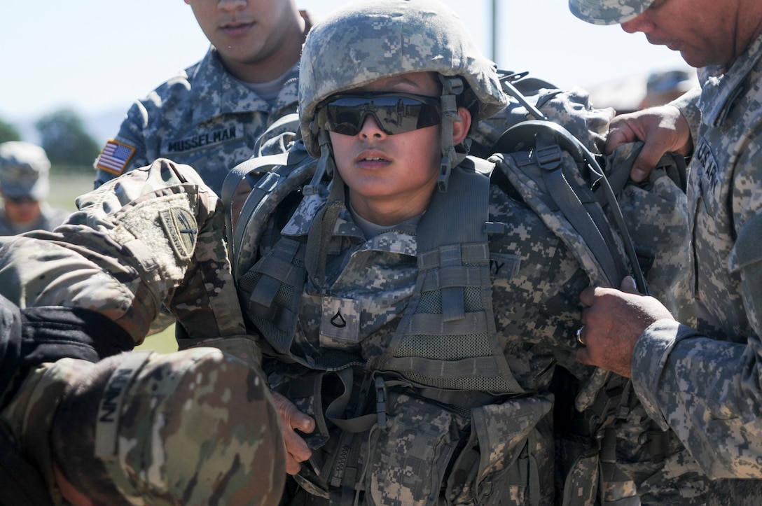 Pfc. Sarah Tuibeo, from 1st Training Brigade, competes in a ruck march at the U.S. Army Civil Affairs and Psychological Operations Command 2016 U.S. Army Best Warrior Competition at Fort Hunter Liggett, Calif., April 5, 2016. This year’s Best Warrior competition will determine the top noncommissioned officer and junior enlisted Soldier who will represent USACAPOC in the Army Reserve Best Warrior competition later this year. (U.S. Army photo by Spc. Khadijah Lutz-Wilcox, USACAPOC)