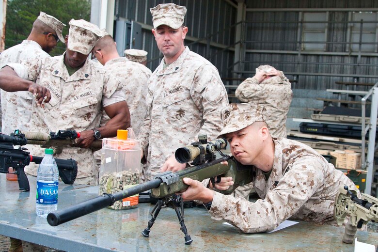 Gunnery Sgt. Leland White, Marine aid for the Marine Corps Combat Development Command, attends Weapons Familiarization Training aboard Marine Corps Base Quantico on April 1. At the range Marines fired the M27, M249 SAW, M9 and the M45 service pistols.