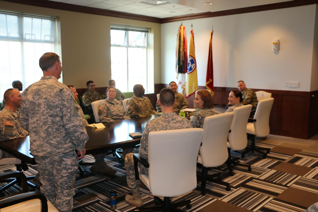 Army Reserve warrant officers from the 310th Sustainment Command (Expeditionary) meet with Brig. Gen. Vincent B. Barker for introductions and to brief him on warrant officer priorities and job specialties at the SPC Luke P. Frist Army Reserve Center, Ind., March 20, 2016.