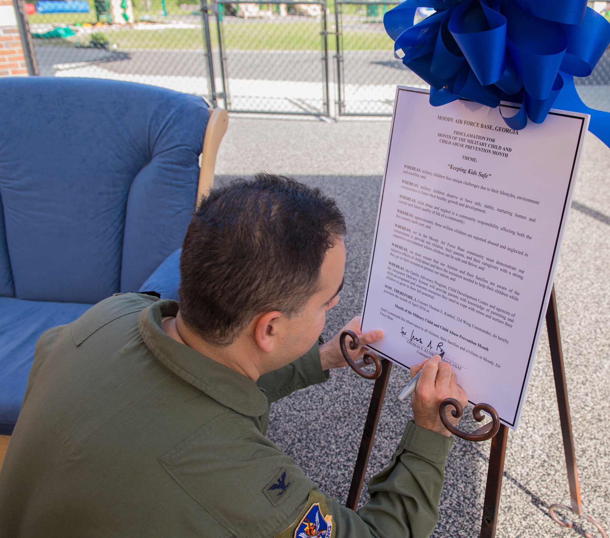 U.S. Air Force Col. Mark Barrera, 23d Wing vice commander, signs a proclamation for National Child Abuse Prevention Month, April 6, 2016, at Moody Air Force Base, Ga. This month acknowledges the importance of families and communities working together to learn about child abuse and neglect, and how to break those cycles. (U.S. Air Force photo by Airman 1st Class Greg Nash/Released) 
